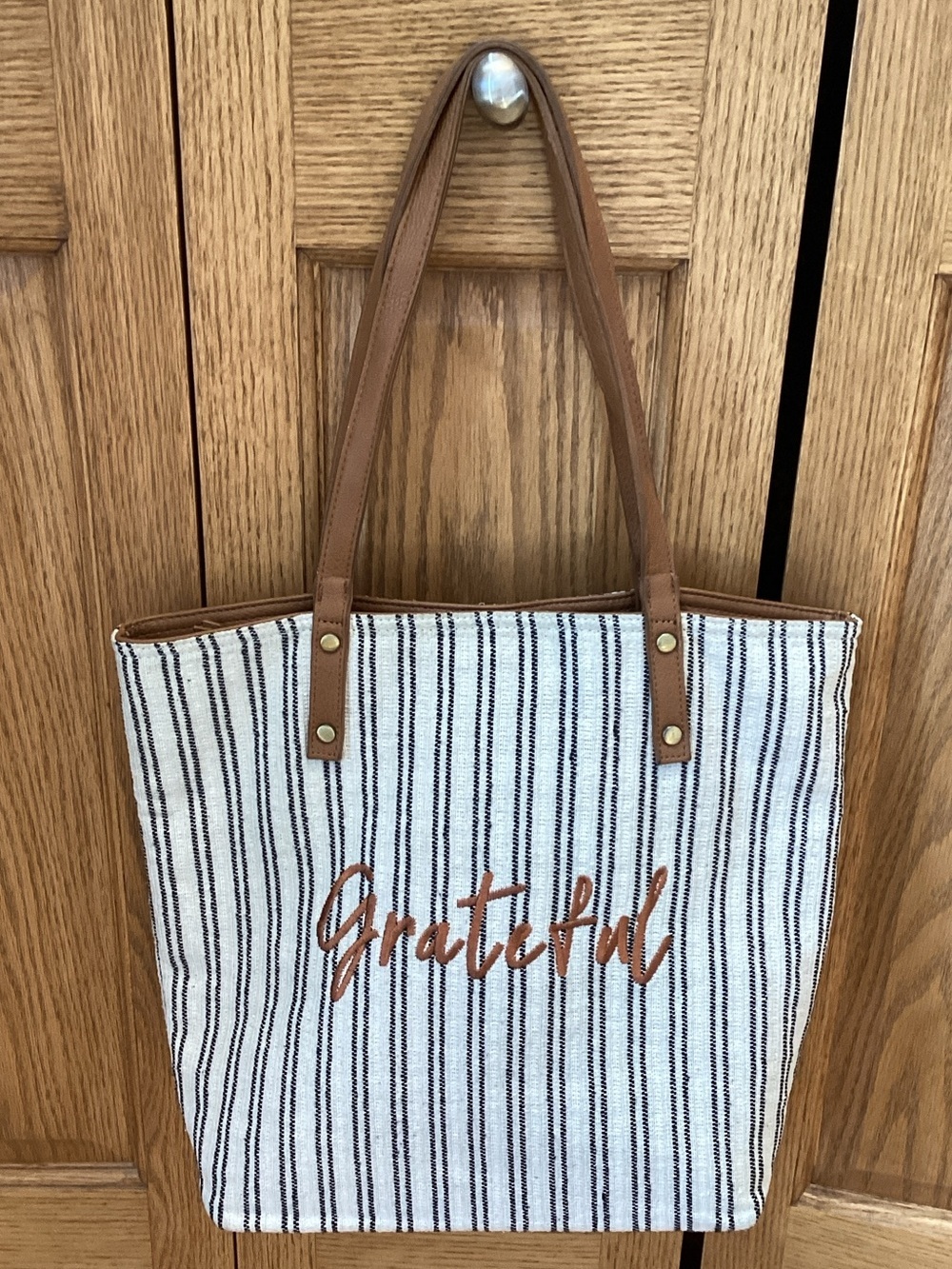“Grateful” blue and white striped tote bag with tan straps